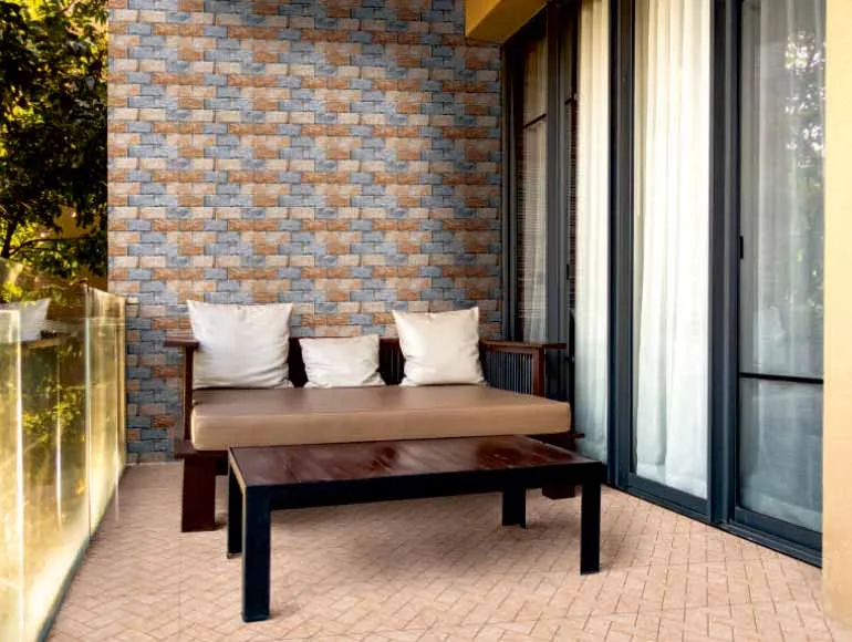 Cozy balcony with brick patterned wall, wooden furniture, and sliding doors in front elevation design.